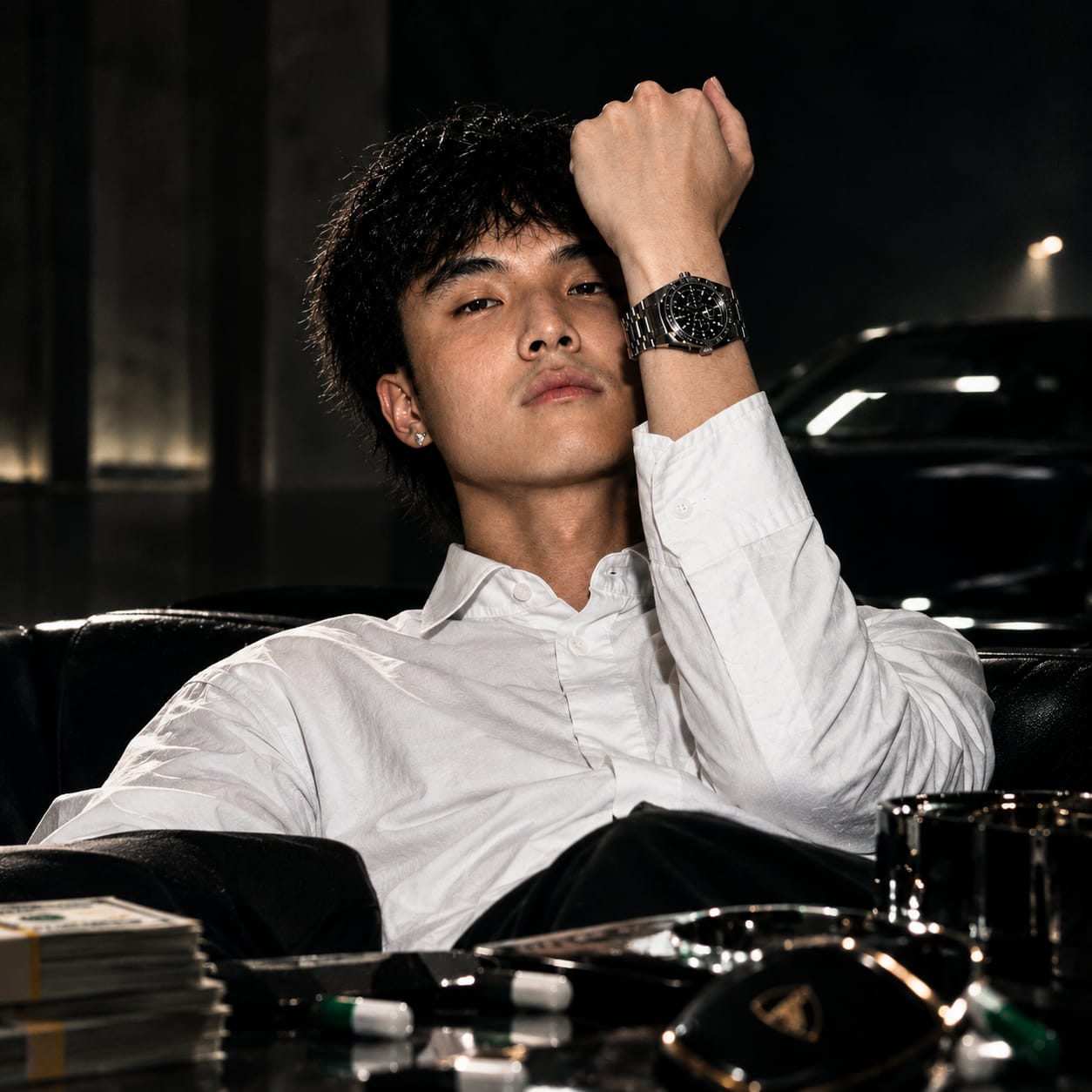 Kimchi raising his wrist to show his stainless-steel chronograph